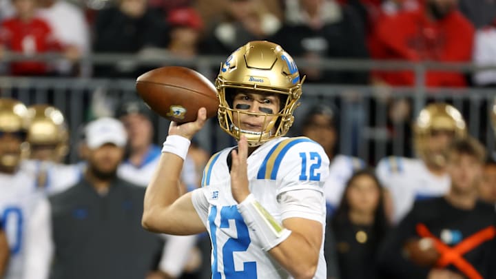 Nov 15, 2025; Columbus, Ohio, USA;  UCLA Bruins quarterback Luke Duncan (12) drops back to throw during the first quarter against the Ohio State Buckeyes at Ohio Stadium. Mandatory Credit: Joseph Maiorana-Imagn Images