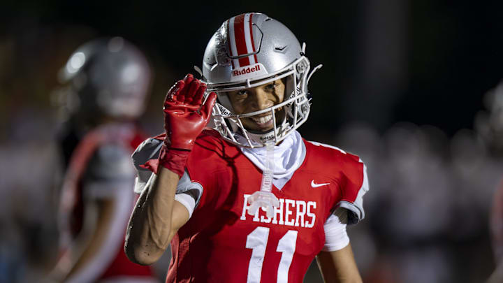 Fishers High School senior JonAnthony Hall (11) gestures toward the teamâ€™s videographer after scoring during the second half of an IHSAA varsity football game against Brownsburg High School, Friday, Sept. 20, 2024, at Fishers High School. Brownsburg won 31-30.