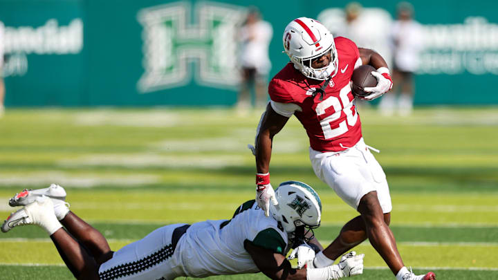 Aug 23, 2025; Honolulu, Hawaii, USA;  Hawaii Rainbow Warriors defensive lineman Tariq Jones (5) tries to tackle Stanford Cardinal running back Sedrick Irvin (26) during the second half at Clarence T.C. Ching Athletics Complex. Mandatory Credit: Marco Garcia-Imagn Images