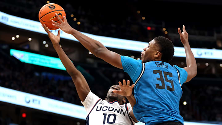 Jan 11, 2025; Washington, District of Columbia, USA; Georgetown Hoyas forward Thomas Sorber (35) blocks a shot attempt made by Connecticut Huskies guard Hassan Diarra (10) during the second half at Capital One Arena. Mandatory Credit: Daniel Kucin Jr.-Imagn Images
