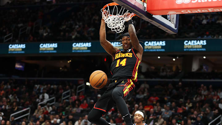 Feb 8, 2025; Washington, District of Columbia, USA; Atlanta Hawks guard Terance Mann (14) dunks during the first half against the Washington Wizards at Capital One Arena. Mandatory Credit: Daniel Kucin Jr.-Imagn Images