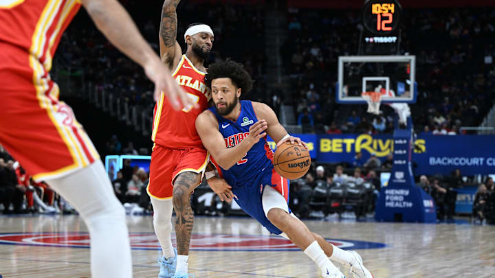 Dec 12, 2025; Detroit, Michigan, USA; Detroit Pistons guard Cade Cunningham (2) drives past Atlanta Hawks guard Nickeil Alexander-Walker (7) in the first quarter at Little Caesars Arena. Mandatory Credit: Lon Horwedel-Imagn Images Dec 12, 2025; Detroit, Michigan, USA; Detroit Pistons guard Cade Cunningham (2) drives past Atlanta Hawks guard Nickeil Alexander-Walker (7) in the first quarter at Little Caesars Arena. Mandatory Credit: Lon Horwedel-Imagn Images