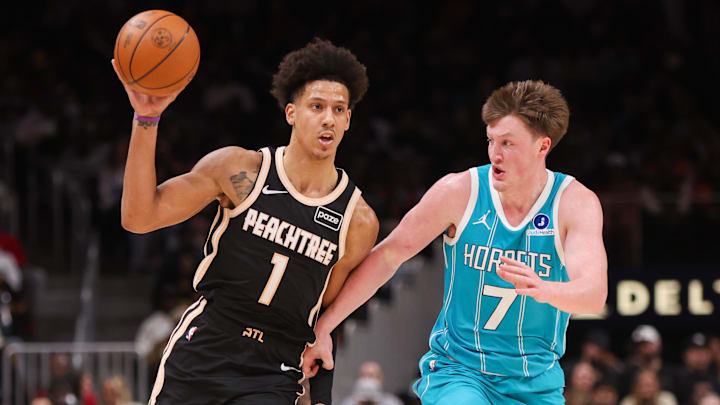 Feb 7, 2026; Atlanta, Georgia, USA; Atlanta Hawks forward Jalen Johnson (1) is defended by Charlotte Hornets guard Kon Knueppel (7) in the second quarter at State Farm Arena. Mandatory Credit: Brett Davis-Imagn Images