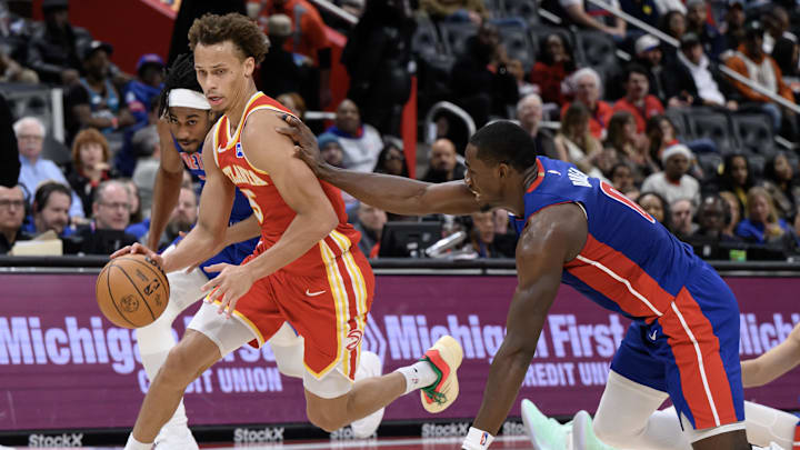 Dec 12, 2025; Detroit, Michigan, USA; Atlanta Hawks guard Dyson Daniels (5) gets fouled by Detroit Pistons center Jalen Duren (0) after stealing the ball in the third quarter at Little Caesars Arena. Mandatory Credit: Lon Horwedel-Imagn Images