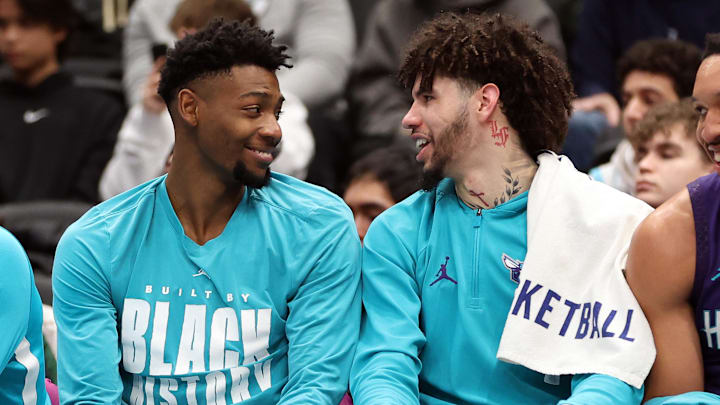 Charlotte Hornets forward Brandon Miller (24) speaks with Charlotte Hornets guard LaMelo Ball