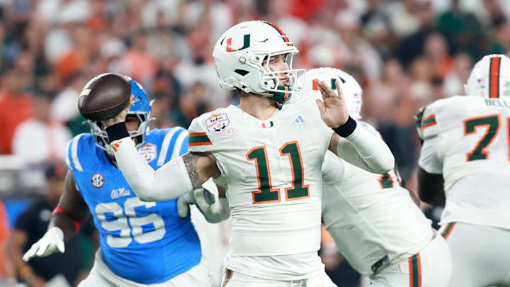 Jan 8, 2026; Glendale, AZ, USA; Miami Hurricanes quarterback Carson Beck (11) drops back to pass against the Mississippi Rebels in the first half during the 2026 Fiesta Bowl and semifinal game of the College Football Playoff at State Farm Stadium. Mandatory Credit: Mark J. Rebilas-Imagn Images
