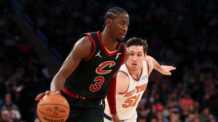 Apr 2, 2022; New York, New York, USA; Cleveland Cavaliers center Moses Brown (6) dribbles the ball past New York Knicks guard Ryan Arcidiacono (51) during the first half at Madison Square Garden. Mandatory Credit: Tom Horak-Imagn Images