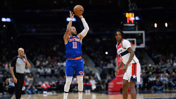 Oct 18, 2024; Washington, District of Columbia, USA; New York Knicks guard Jalen Brunson (11) shoots a jump shot over Washington Wizards guard Bub Carrington (8) during the second quarter at Capital One Arena. Mandatory Credit: Reggie Hildred-Imagn Images