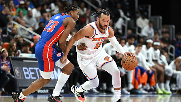 Nov 1, 2024; Detroit, Michigan, USA; New York Knicks guard Jalen Brunson (11) drive past Detroit Pistons guard Jaden Ivey (23) in the third quarter at Little Caesars Arena. Mandatory Credit: Lon Horwedel-Imagn Images