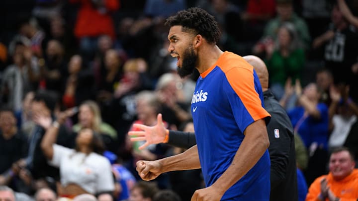 Oct 18, 2024; Washington, District of Columbia, USA; New York Knicks center Karl-Anthony Towns (32) reacts on the bench during the fourth quarter against the Washington Wizards at Capital One Arena. Mandatory Credit: Reggie Hildred-Imagn Images