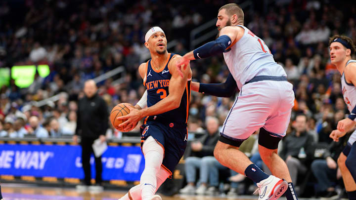 Dec 30, 2024; Washington, District of Columbia, USA; New York Knicks guard Josh Hart (3) drives to the basket against Washington Wizards center Jonas Valanciunas (17) during the second quarter at Capital One Arena. Mandatory Credit: Reggie Hildred-Imagn Images