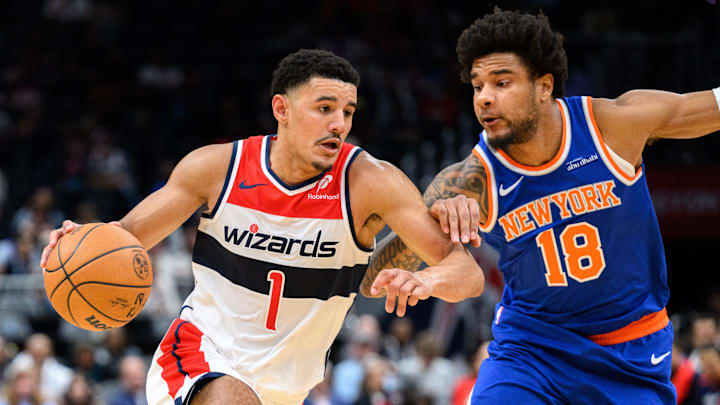 Oct 18, 2024; Washington, District of Columbia, USA; Washington Wizards guard Johnny Davis (1) dribbles the ball to the basket against New York Knicks forward Chuma Okeke (18) during the fourth quarter at Capital One Arena. Mandatory Credit: Reggie Hildred-Imagn Images