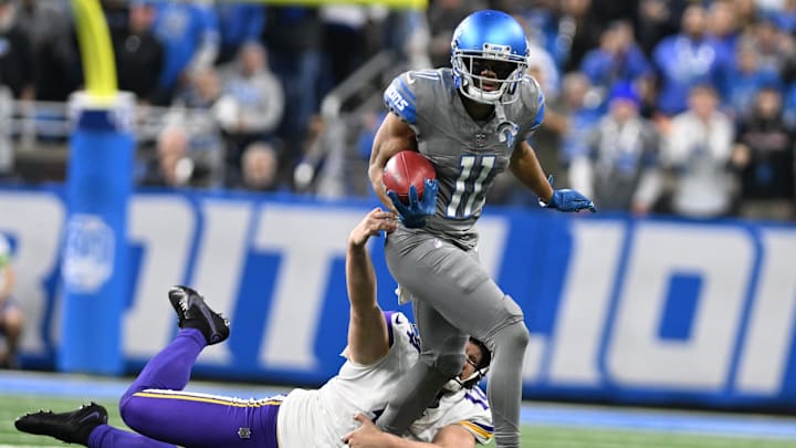 Jan 7, 2024; Detroit, Michigan, USA; Detroit Lions punt returner Kalif Raymond (11) tries to break a tackle against the Minnesota Vikings. Jan 7, 2024; Detroit, Michigan, USA; Detroit Lions punt returner Kalif Raymond (11) tries to break a tackle against the Minnesota Vikings.