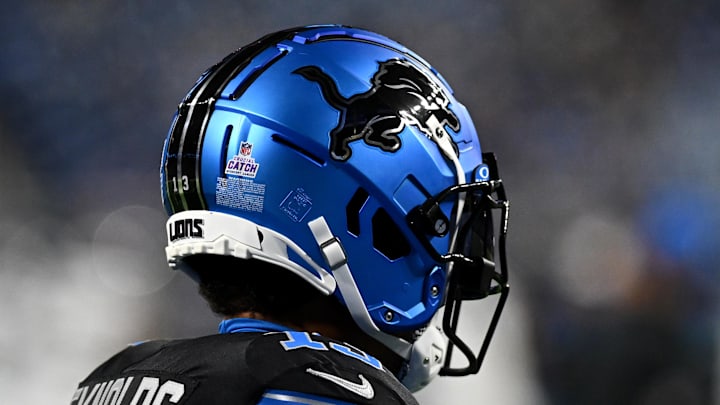 Detroit Lions running back Craig Reynolds (13) wears the Lions new helmets. Detroit Lions running back Craig Reynolds (13) wears the Lions new helmets.