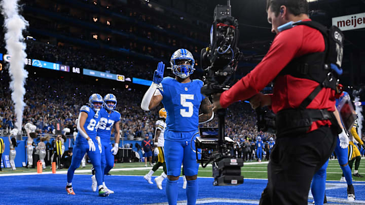Dec 5, 2024; Detroit, Michigan, USA;  Detroit Lions running back David Montgomery (5) celebrates after scoring a touchdown against the Green Bay Packers in the first quarter at Ford Field. Mandatory Credit: Lon Horwedel-Imagn Images