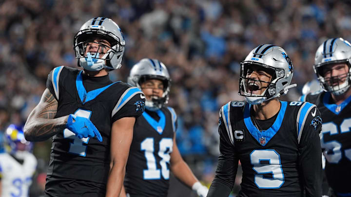Jan 10, 2026; Charlotte, NC, USA; Carolina Panthers quarterback Bryce Young (9) reacts after scoring a touchdown against the Los Angeles Rams in the first half during the NFC Wild Card Round game at Bank of America Stadium. Mandatory Credit: Jim Dedmon-Imagn Images