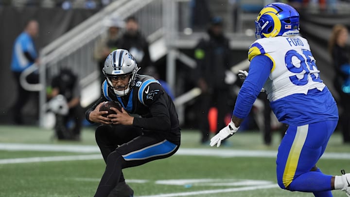 Los Angeles Rams defensive tackle Poona Ford (95) applies pressure on Carolina Panthers quarterback Bryce Young 
