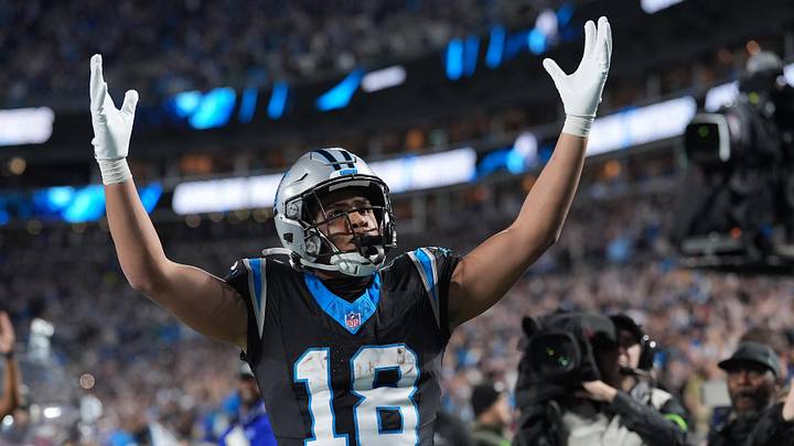 Jan 10, 2026; Charlotte, NC, USA; Carolina Panthers wide receiver Jalen Coker (18) reacts after making a touchdown against the Los Angeles Rams in the second half during the NFC Wild Card Round game at Bank of America Stadium. Mandatory Credit: Jim Dedmon-Imagn Images Jan 10, 2026; Charlotte, NC, USA; Carolina Panthers wide receiver Jalen Coker (18) reacts after making a touchdown against the Los Angeles Rams in the second half during the NFC Wild Card Round game at Bank of America Stadium. Mandatory Credit: Jim Dedmon-Imagn Images