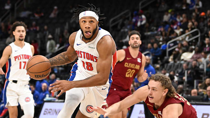 Oct 16, 2024; Detroit, Michigan, USA; Detroit Pistons guard Lamar Stevens (18) drives past Cleveland Cavaliers guard Luke Travers (33) in the third quarter at Little Caesars Arena. Mandatory Credit: Lon Horwedel-Imagn Images Oct 16, 2024; Detroit, Michigan, USA; Detroit Pistons guard Lamar Stevens (18) drives past Cleveland Cavaliers guard Luke Travers (33) in the third quarter at Little Caesars Arena. Mandatory Credit: Lon Horwedel-Imagn Images