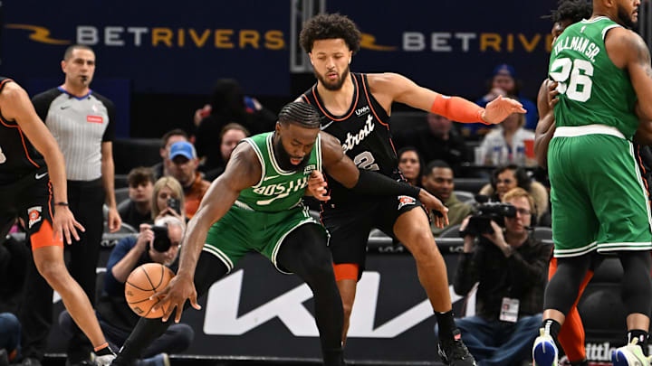 Mar 22, 2024; Detroit, Michigan, USA; Boston Celtics guard Jaylen Brown (7) tries to maintain control of the ball while being guarded by Detroit Pistons guard Cade Cunningham (2) in the first quarter at Little Caesars Arena. Mandatory Credit: Lon Horwedel-Imagn Images Mar 22, 2024; Detroit, Michigan, USA; Boston Celtics guard Jaylen Brown (7) tries to maintain control of the ball while being guarded by Detroit Pistons guard Cade Cunningham (2) in the first quarter at Little Caesars Arena. Mandatory Credit: Lon Horwedel-Imagn Images