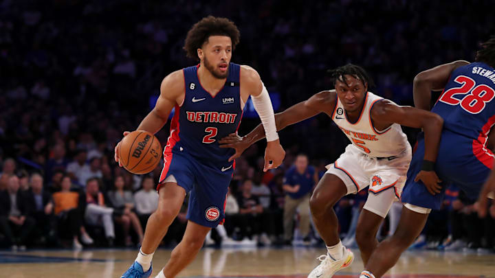Oct 21, 2022; New York, New York, USA; Detroit Pistons guard Cade Cunningham (2) moves the ball past New York Knicks guard Immanuel Quickley (5) during the second quarter at Madison Square Garden. Mandatory Credit: Tom Horak-Imagn Images