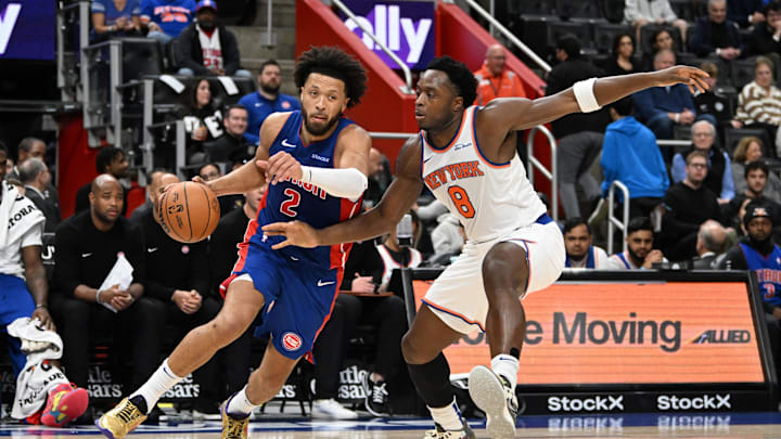 Nov 1, 2024; Detroit, Michigan, USA; Detroit Pistons guard Cade Cunningham (2) drives past New York Knicks forward OG Anunoby (8)  in the second quarter at Little Caesars Arena. Mandatory Credit: Lon Horwedel-Imagn Images