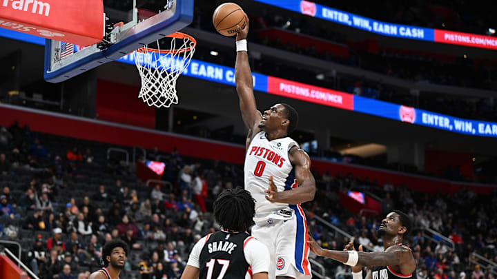 Jan 6, 2025; Detroit, Michigan, USA;  Detroit Pistons center Jalen Duren (0) dunks the ball over Portland Trail Blazers guard Shaedon Sharpe (17) in the third quarter at Little Caesars Arena. Mandatory Credit: Lon Horwedel-Imagn Images