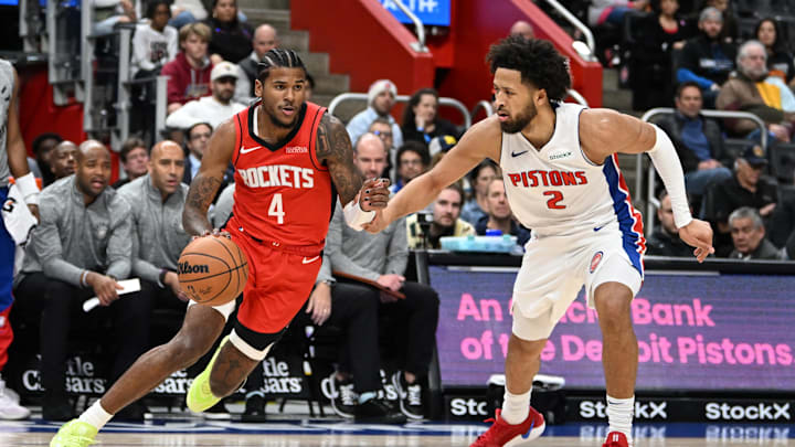 Nov 10, 2024; Detroit, Michigan, USA;  Houston Rockets guard Jalen Green (4) drives past Detroit Pistons guard Cade Cunningham (2) in the first quarter at Little Caesars Arena. Mandatory Credit: Lon Horwedel-Imagn Images