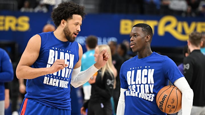 Feb 9, 2025; Detroit, Michigan, USA; Detroit Pistons guard Cade Cunningham (2) talks to newly acquired Pistons guard, Dennis Schroder (right) during pregame warmups before their game against the Charlotte Hornets at Little Caesars Arena. Mandatory Credit: Lon Horwedel-Imagn Images