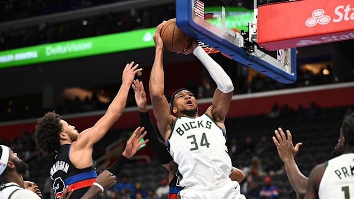 Dec 3, 2024; Detroit, Michigan, USA; Milwaukee Bucks forward Giannis Antetokounmpo (34) grabs an offensive rebound away from Detroit Pistons guard Cade Cunningham (2) in the first quarter at Little Caesars Arena. Mandatory Credit: Lon Horwedel-Imagn Images Dec 3, 2024; Detroit, Michigan, USA; Milwaukee Bucks forward Giannis Antetokounmpo (34) grabs an offensive rebound away from Detroit Pistons guard Cade Cunningham (2) in the first quarter at Little Caesars Arena. Mandatory Credit: Lon Horwedel-Imagn Images