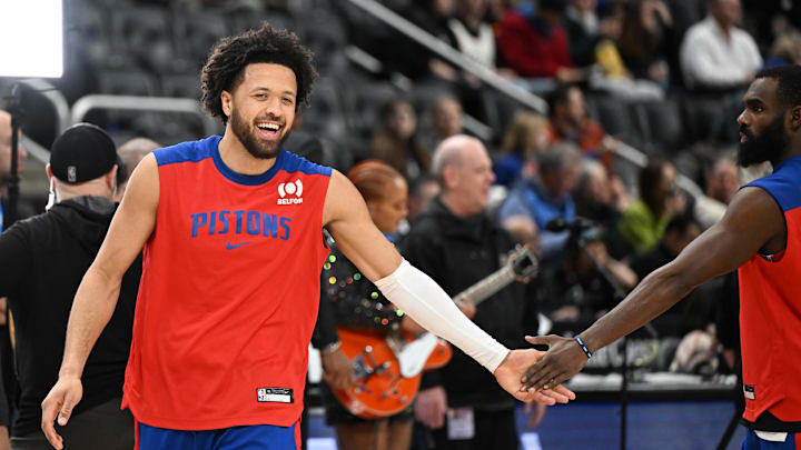 Jan 1, 2025; Detroit, Michigan, USA;  Detroit Pistons guard Cade Cunningham (2) greets teammate Tim Hardaway Jr. (8) during pregame warmups before their game against the Orlando Magic at Little Caesars Arena. Mandatory Credit: Lon Horwedel-Imagn Images