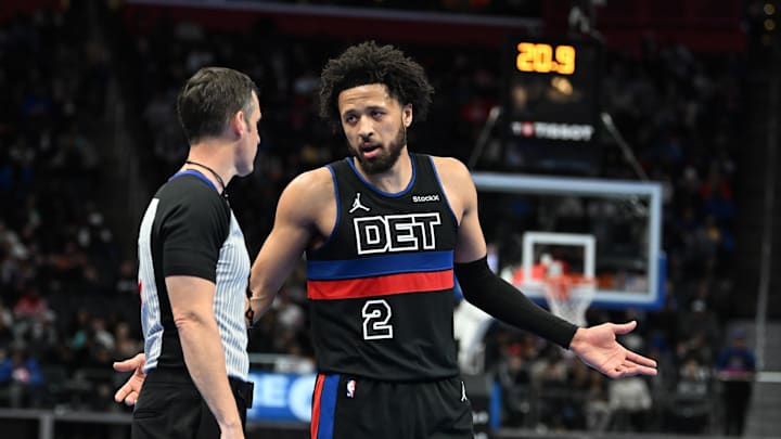Dec 3, 2024; Detroit, Michigan, USA; Detroit Pistons guard Cade Cunningham (2) talks with the referee during a break in the action against the Milwaukee Bucks in the second quarter at Little Caesars Arena. Mandatory Credit: Lon Horwedel-Imagn Images