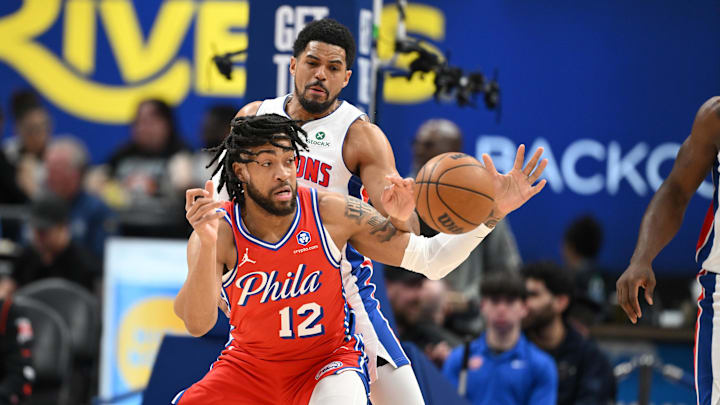 Mar 12, 2026; Detroit, Michigan, USA;  Detroit Pistons forward Tobias Harris (12) knocks the ball out of the hands of Philadelphia 76ers forward Trendon Watford (12) in the first half at Little Caesars Arena. Mandatory Credit: Lon Horwedel-Imagn Images