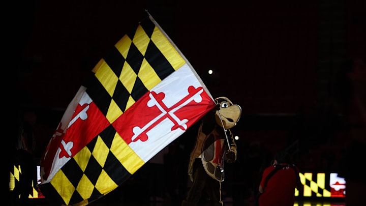 Nov 11, 2024; College Park, Maryland, USA; Maryland Terrapins mascot waves a flag before the game between the Maryland Terrapins and the Florida A&M Rattlers at Xfinity Center. Mandatory Credit: Reggie Hildred-Imagn Images