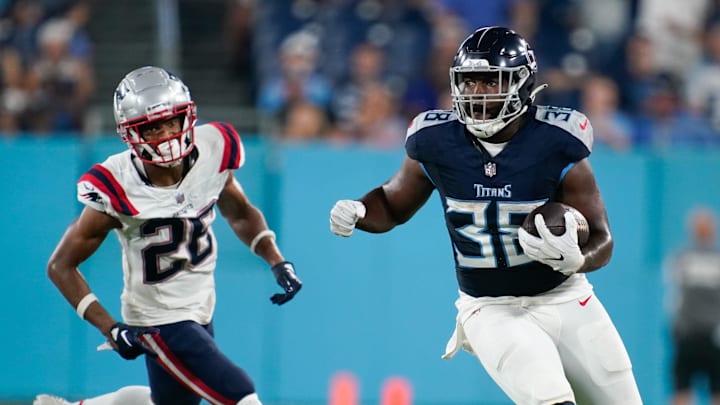 Tennessee Titans running back Jacques Patrick (38) runs the ball past New England Patriots cornerback Shaun Wade (26) during the third quarter at Nissan Stadium in Nashville, Tenn., Friday, Aug. 25, 2023. Tennessee Titans running back Jacques Patrick (38) runs the ball past New England Patriots cornerback Shaun Wade (26) during the third quarter at Nissan Stadium in Nashville, Tenn., Friday, Aug. 25, 2023.