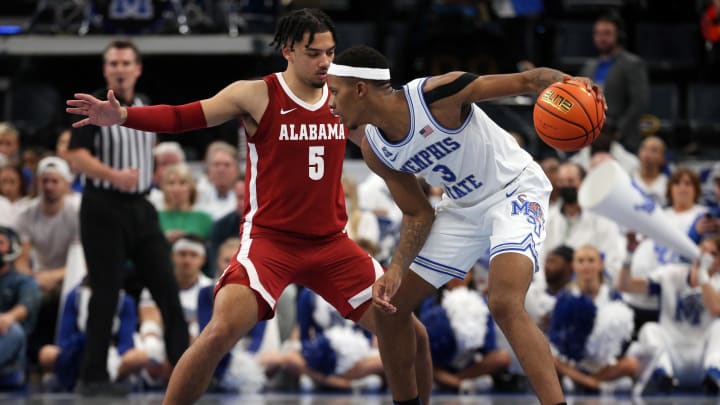 Dec 14, 2021; Memphis, Tennessee, USA; Memphis Tigers guard Landers Nolley II (3) dribbles as Alabama Crimson Tide guard Jaden Shackelford (5) defends during the second half at FedExForum. Mandatory Credit: Petre Thomas-USA TODAY Sports Dec 14, 2021; Memphis, Tennessee, USA; Memphis Tigers guard Landers Nolley II (3) dribbles as Alabama Crimson Tide guard Jaden Shackelford (5) defends during the second half at FedExForum. Mandatory Credit: Petre Thomas-USA TODAY Sports