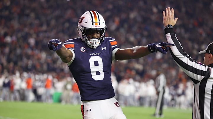 Nov 23, 2024; Auburn, Alabama, USA; Auburn Tigers wide receiver Cam Coleman (8) celebrates after scoring a touchdown against the Texas A&M Aggies during the third quarter at Jordan-Hare Stadium. Mandatory Credit: John Reed-Imagn Images Nov 23, 2024; Auburn, Alabama, USA; Auburn Tigers wide receiver Cam Coleman (8) celebrates after scoring a touchdown against the Texas A&M Aggies during the third quarter at Jordan-Hare Stadium. Mandatory Credit: John Reed-Imagn Images