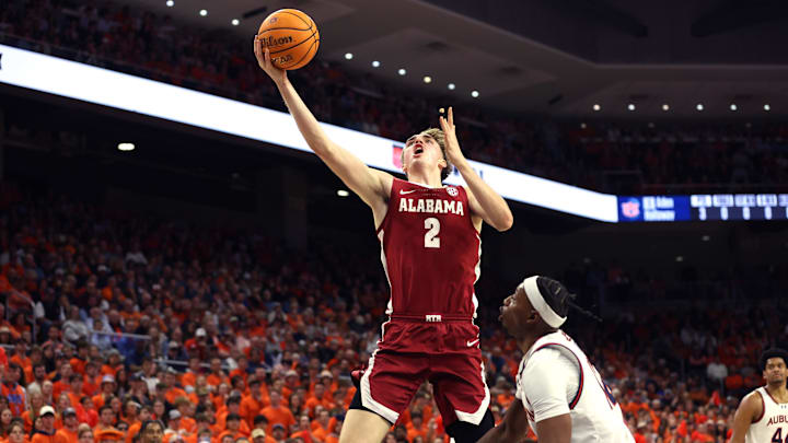 Feb 7, 2024; Auburn, Alabama, USA; Alabama Crimson Tide forward Grant Nelson (2) takes a shot over Auburn Tigers guard Denver Jones (12) during the first half at Neville Arena. Mandatory Credit: John Reed-Imagn Images Feb 7, 2024; Auburn, Alabama, USA; Alabama Crimson Tide forward Grant Nelson (2) takes a shot over Auburn Tigers guard Denver Jones (12) during the first half at Neville Arena. Mandatory Credit: John Reed-Imagn Images