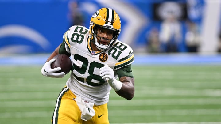 Nov 23, 2023; Detroit, Michigan, USA; Green Bay Packers running back AJ Dillon (28) runs the ball against the Detroit Lions in the first quarter at Ford Field. Mandatory Credit: Lon Horwedel-USA TODAY Sports Nov 23, 2023; Detroit, Michigan, USA; Green Bay Packers running back AJ Dillon (28) runs the ball against the Detroit Lions in the first quarter at Ford Field. Mandatory Credit: Lon Horwedel-USA TODAY Sports
