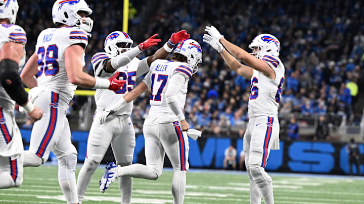 Dec 15, 2024; Detroit, Michigan, USA; Buffalo Bills quarterback Josh Allen (17) celebrates with tight end Quintin Morris (85) and tight end Dalton Kincaid (86) after scoring his second touchdown against the Detroit Lions in the first quarter Dec 15, 2024; Detroit, Michigan, USA; Buffalo Bills quarterback Josh Allen (17) celebrates with tight end Quintin Morris (85) and tight end Dalton Kincaid (86) after scoring his second touchdown against the Detroit Lions in the first quarter