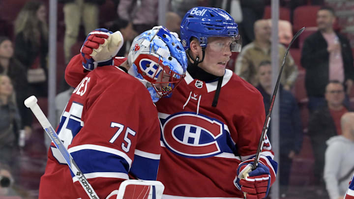 Sep 23, 2024; Montreal, Quebec, CAN; Montreal Canadiens goalie Jakub Dobes (75) and forward Patrik Laine (92) celebrate the win against the Philadelphia Flyers at the Bell Centre. Mandatory Credit: Eric Bolte-Imagn Images