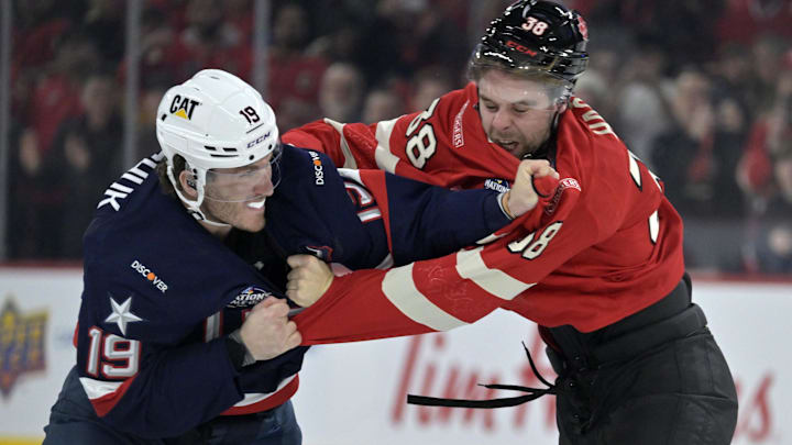 Feb 15, 2025; Montreal, Quebec, CAN; [Imagn Images direct customers only] Team United States forward Matthew Tkachuk (19) and Team Canada forward brandon Hagel (38) fight in the first period during a 4 Nations Face-Off ice hockey game at the Bell Centre. Mandatory Credit: Eric Bolte-Imagn Images