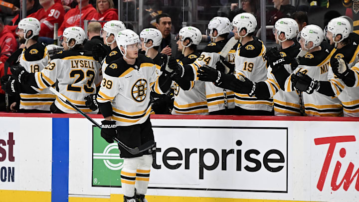 Mar 29, 2025; Detroit, Michigan, USA; Boston Bruins center Morgan Geekie (39) celebrates after scoring a power play goal against the Detroit Red Wings in the second period at Little Caesars Arena. Mandatory Credit: Lon Horwedel-Imagn Images