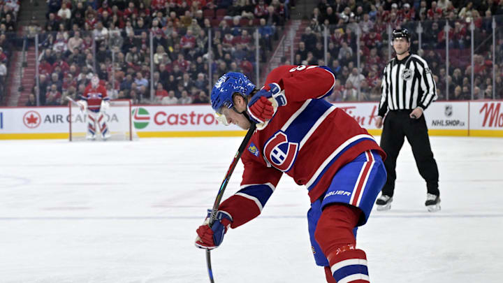 Apr 8, 2025; Montreal, Quebec, CAN; Montreal Canadiens forward Patrik Laine (92) takes a shot on net during the second period of the game against the Detroit Red Wings  at the Bell Centre. Mandatory Credit: Eric Bolte-Imagn Images