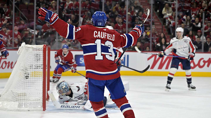 Apr 25, 2025; Montreal, Quebec, CAN; Montreal Canadiens forward Cole Caufield (13) celebrates after scoring a goal against Washington Capitals goalie Logan Thompson (48) during the second period in game three of the first round of the 2025 Stanley Cup Playoffs at the Bell Centre. Mandatory Credit: Eric Bolte-Imagn Images