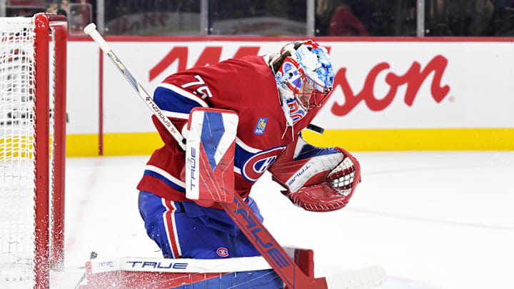 Dec 18, 2025; Montreal, Quebec, CAN; Montreal Canadiens goalie Jakub Dobes (75) makes a save against the Chicago Blackhawks during the second period at the Bell Centre. Mandatory Credit: Eric Bolte-Imagn Images