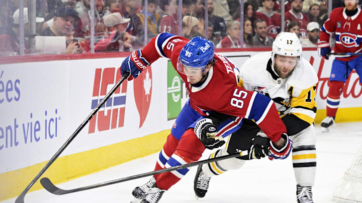 Dec 20, 2025; Montreal, Quebec, CAN; Montreal Canadiens forward Alexandre Texier (85) plays the puck and Pittsburgh Penguins forward Bryan Rust (17) defends during the third period at the Bell Centre. Mandatory Credit: Eric Bolte-Imagn Images