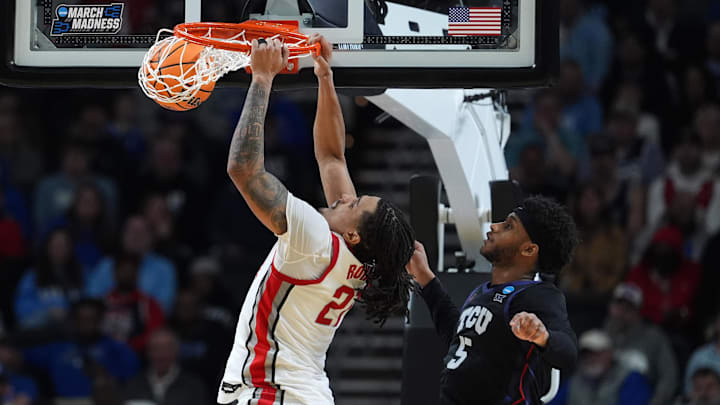 Mar 19, 2026; Greenville, SC, USA; Ohio State Buckeyes forward Devin Royal (21) dunks the ball over Texas Christian University Horned Frogs forward Micah Robinson (5) in the second half during a first round game of the men's 2026 NCAA Tournament at Bon Secours Wellness Arena. Mandatory Credit: Jim Dedmon-Imagn Images