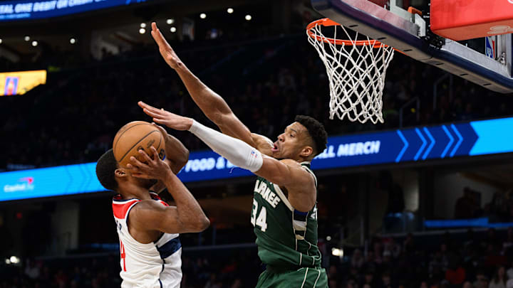 Apr 2, 2024; Washington, District of Columbia, USA; Milwaukee Bucks forward Giannis Antetokounmpo (34) defends against Washington Wizards guard Jared Butler (4) during the fourth quarter at Capital One Arena. Mandatory Credit: Reggie Hildred-Imagn Images