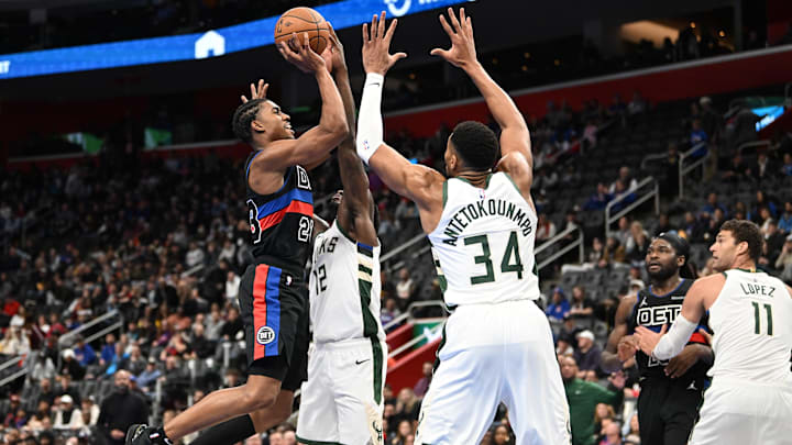 Dec 3, 2024; Detroit, Michigan, USA; Detroit Pistons guard Jaden Ivey (23) shoots the ball over Milwaukee Bucks forwards Taurean Prince (12) and Giannis Antetokounmpo (34) in the third quarter at Little Caesars Arena. Mandatory Credit: Lon Horwedel-Imagn Images Dec 3, 2024; Detroit, Michigan, USA; Detroit Pistons guard Jaden Ivey (23) shoots the ball over Milwaukee Bucks forwards Taurean Prince (12) and Giannis Antetokounmpo (34) in the third quarter at Little Caesars Arena. Mandatory Credit: Lon Horwedel-Imagn Images